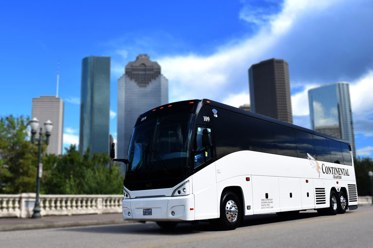 Group Charters Houston Texas Skyline White Luxury Bus In Front Of Buildings