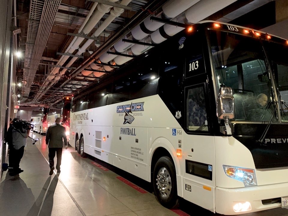 Athletic team charter bus with equipment storage