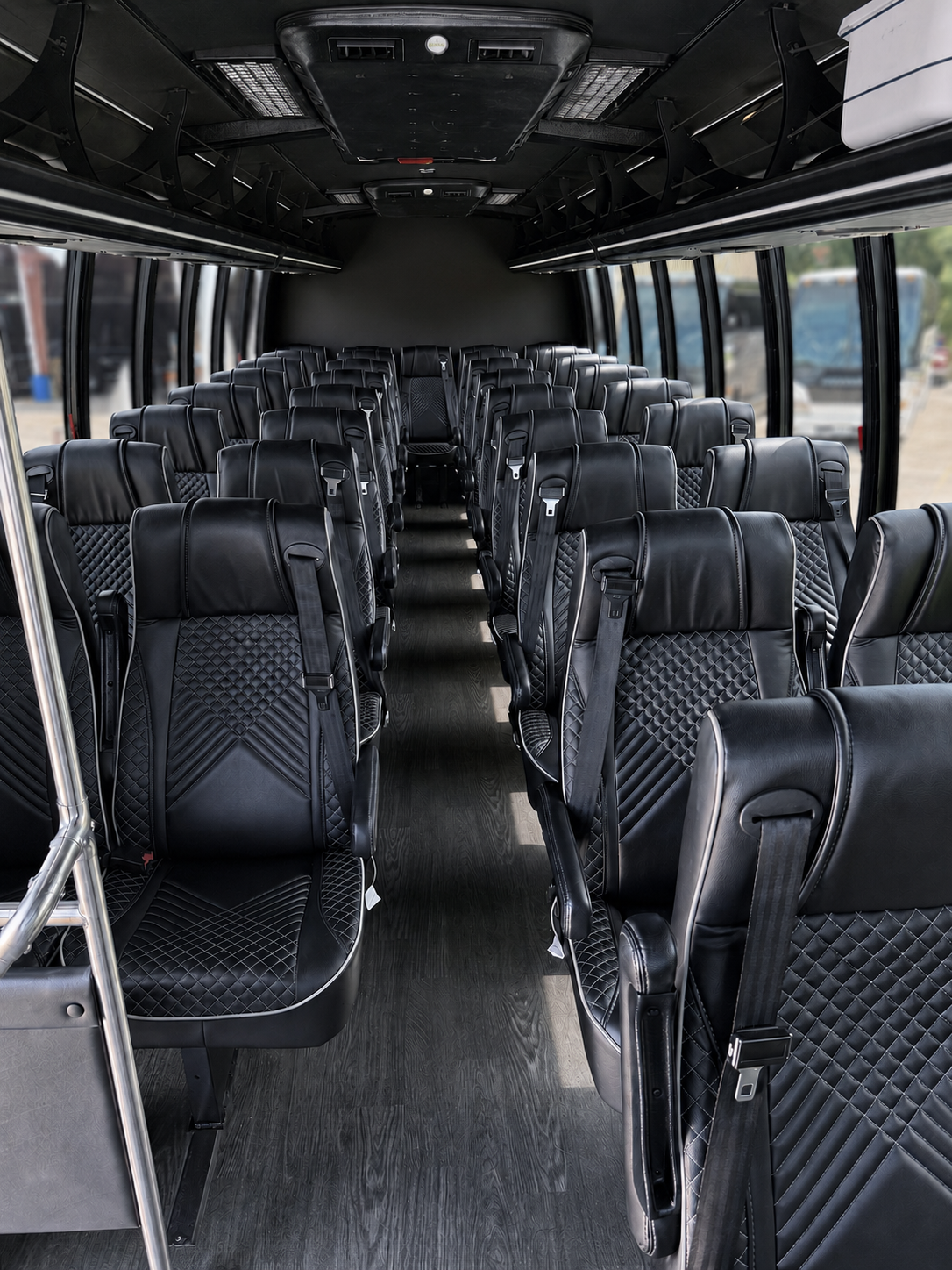 Lit wood-finish entrance steps of Houston minibus rental