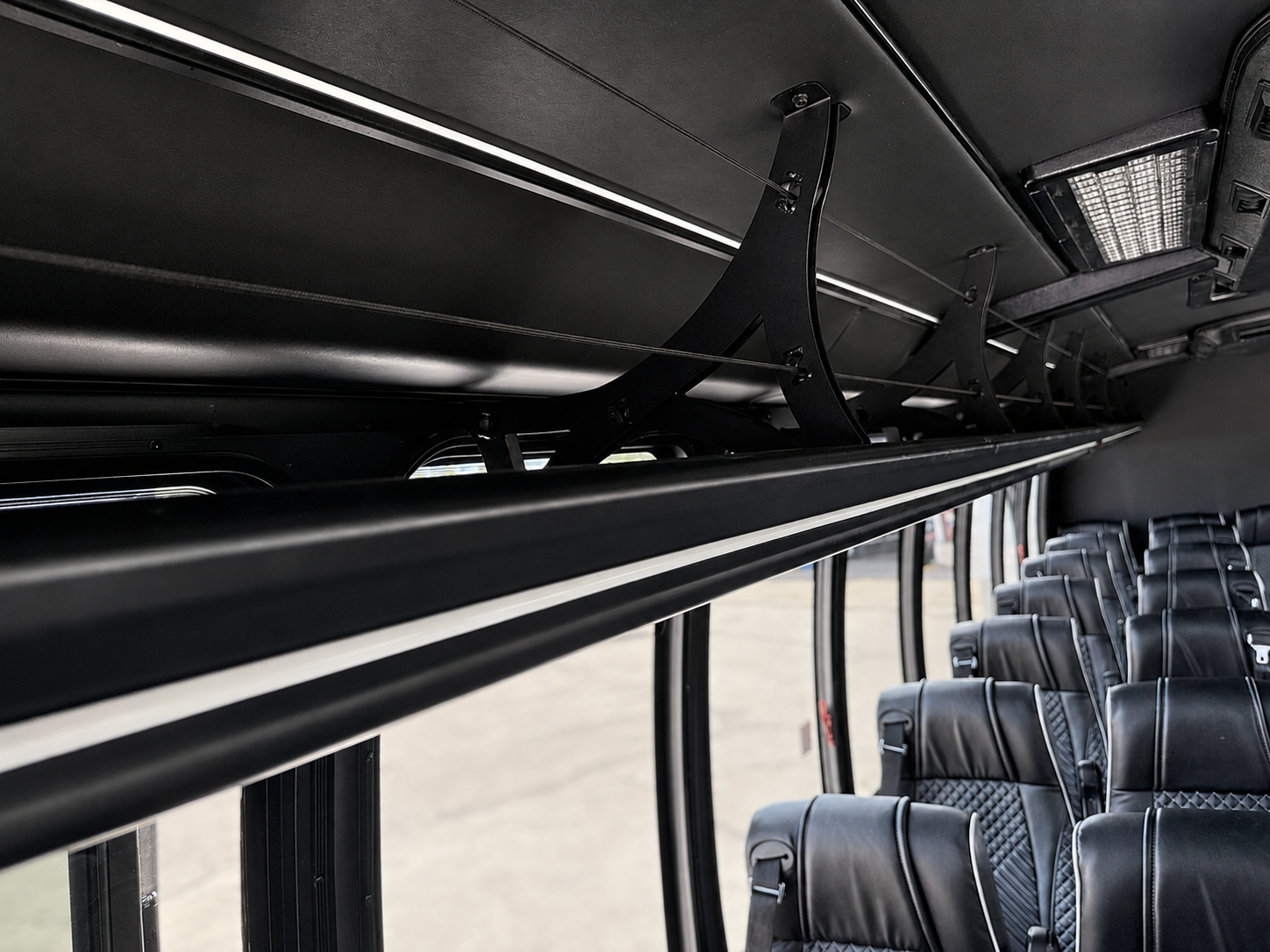 Overhead interior storage racks on Houston minibus