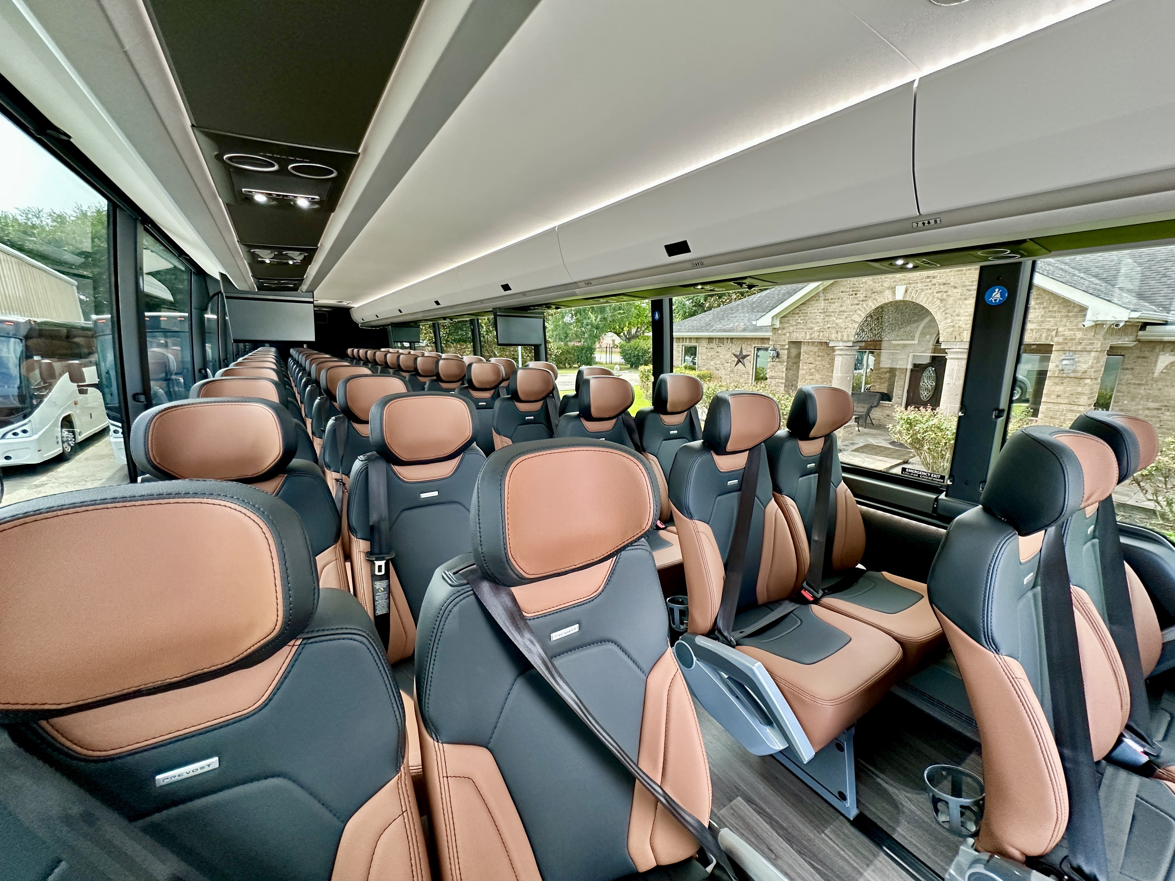 Full cabin interior of Houston charter motor coach with premium leather seating